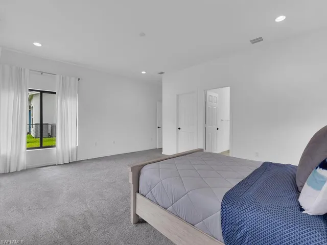 a bathroom with double sink and a mirror