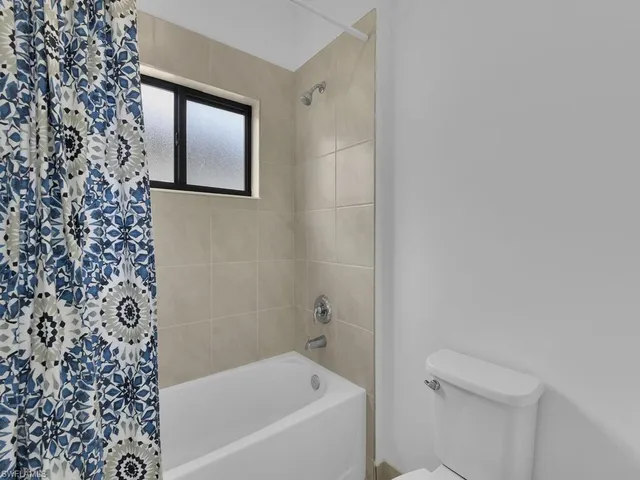 a bathroom with 2 sink and a mirror