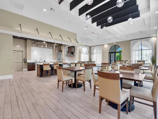 a kitchen with a sink and a potted plant