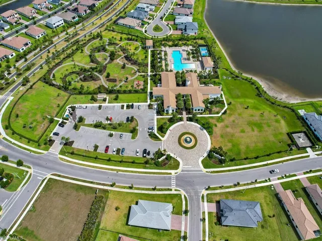 an aerial view of a wooden table and chairs