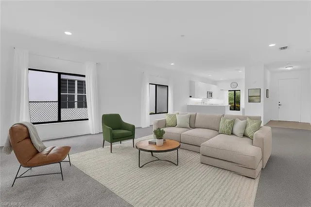 a living room with furniture and a couch