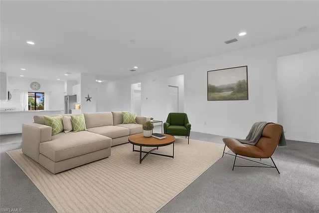 a living room with furniture and a rug