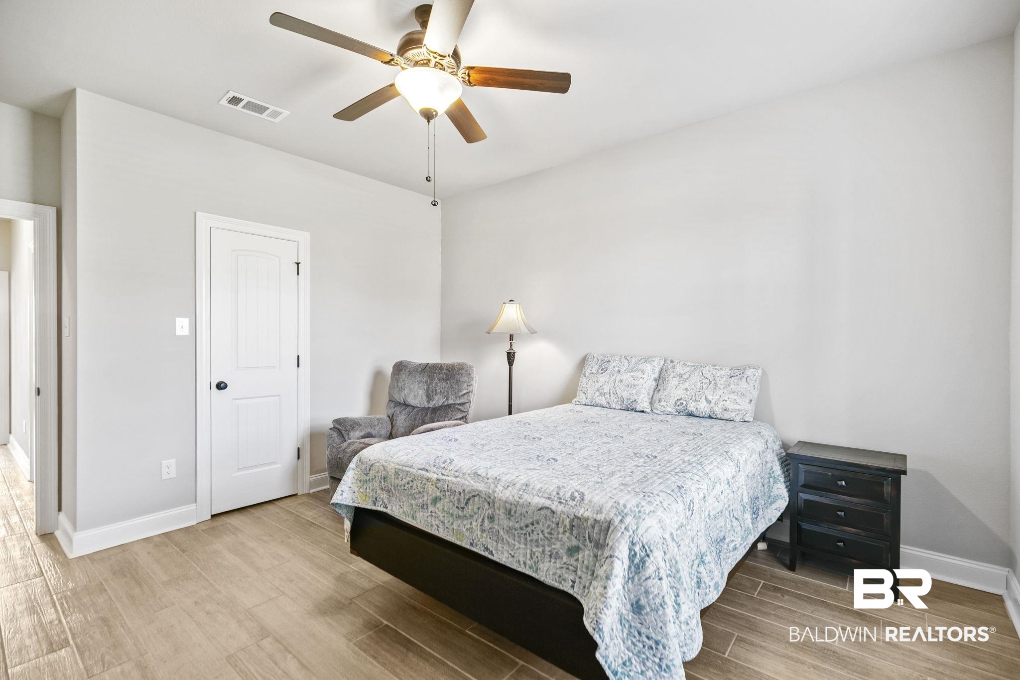 10140 Chipper Lane Foley, AL 36535 - Photo 37 of 72 Bedroom with ceiling fan and light wood-type flooring