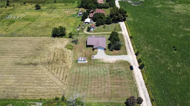 an aerial view of a golf course with parking space
