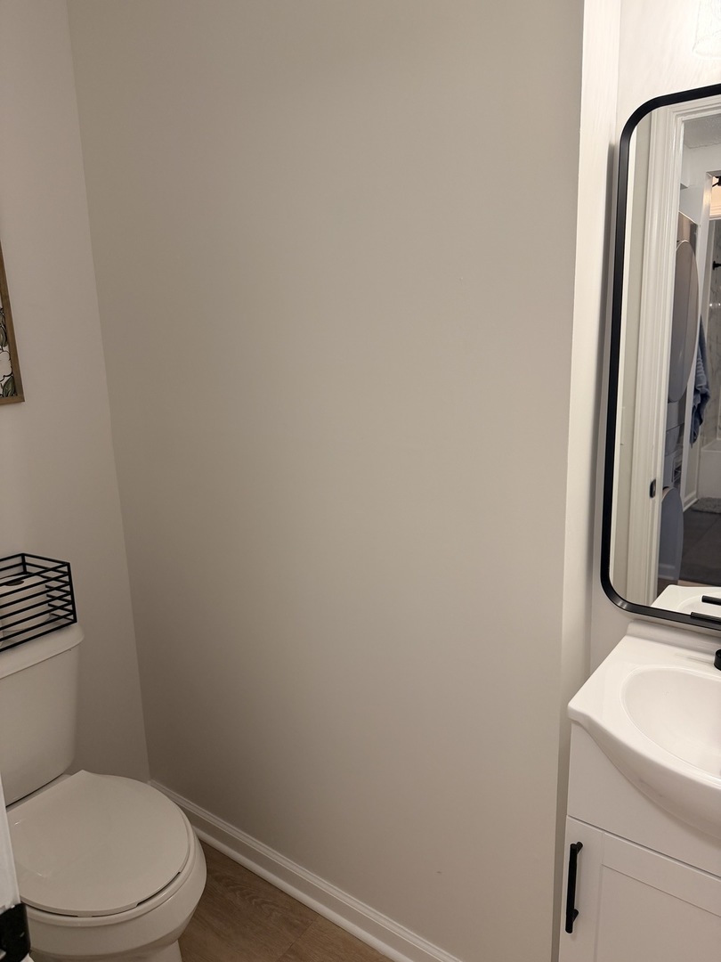 903 North Linden Street, Unit 28 Normal, IL 61761 - Photo 16 of 18 a white toilet sitting next to a bathroom sink