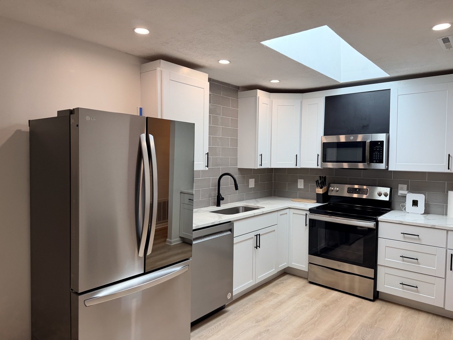 903 North Linden Street, Unit 28 Normal, IL 61761 - Photo 5 of 18 a kitchen with stainless steel appliances a refrigerator stove and sink