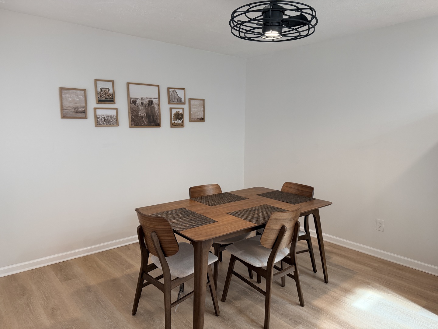 903 North Linden Street, Unit 28 Normal, IL 61761 - Photo 7 of 18 a view of a dining room with furniture and wooden floor