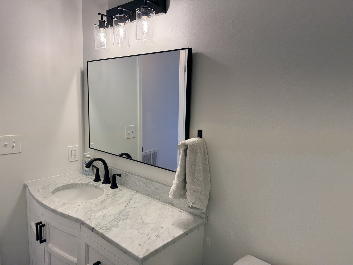 903 North Linden Street, Unit 28 Normal, IL 61761 - Photo 8 of 18 a bathroom with a sink and a mirror