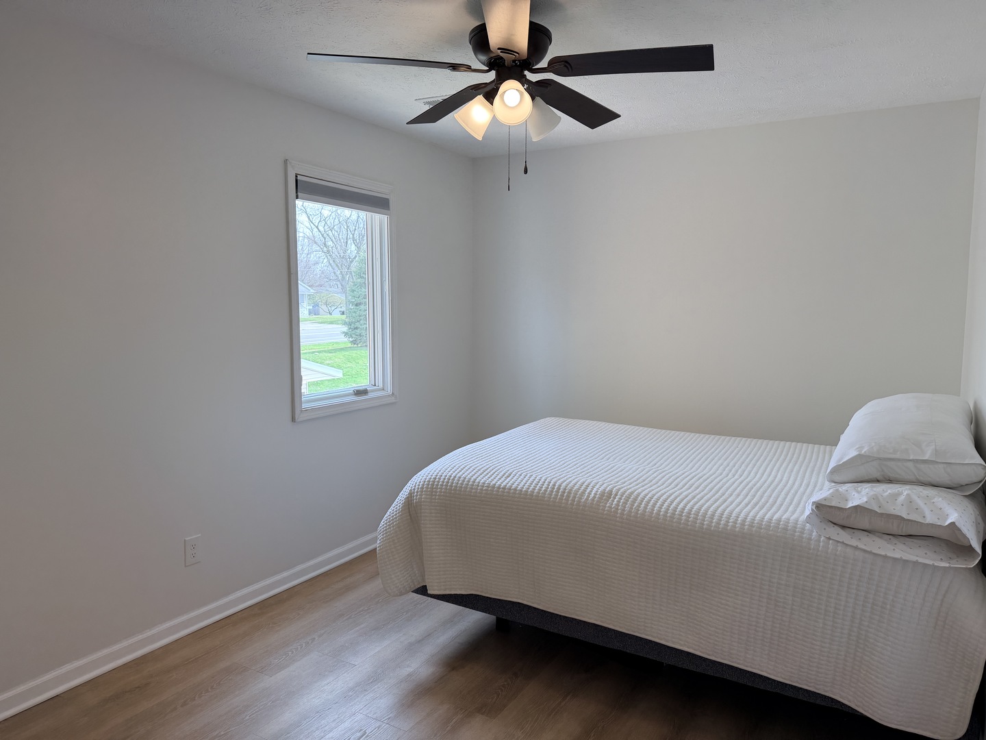 903 North Linden Street, Unit 28 Normal, IL 61761 - Photo 9 of 18 a bed sitting in a bedroom next to a window