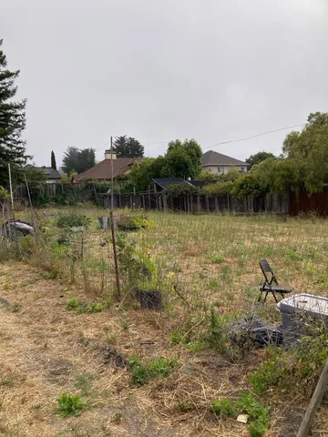 a view of a lake with houses in the back