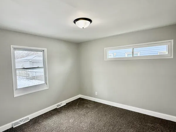 an empty room with a workbench