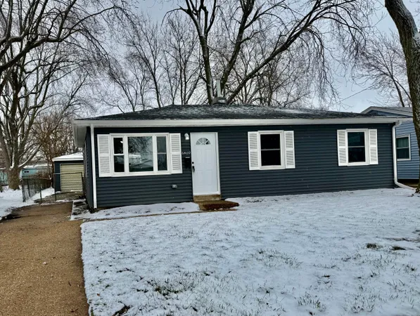 a house with trees in the background