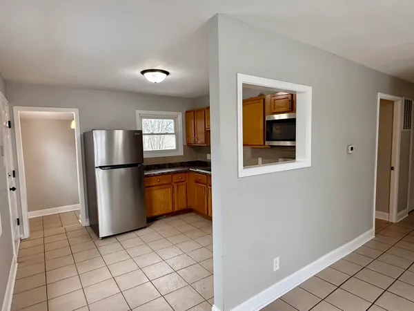 a kitchen with stainless steel appliances a refrigerator and a sink