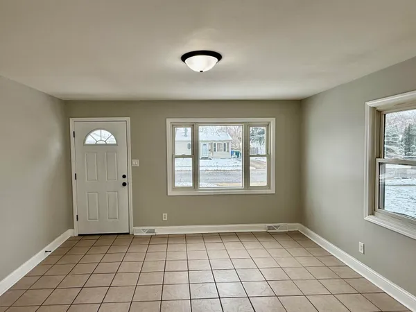 a view of an empty room and window