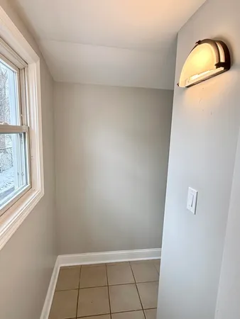 a view of walk in closet with window