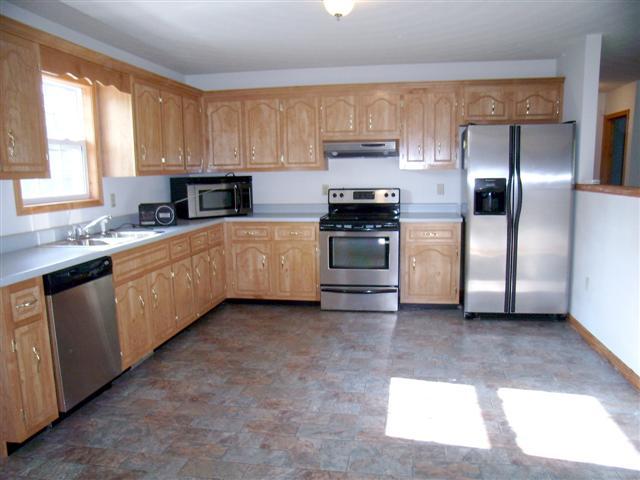 159 Hickory Road Big Rock, TN 37023 - Photo 11 of 20 Generous sized country kitchen. Ample cabinet space, vinyl flooring, stainless steel appliances.