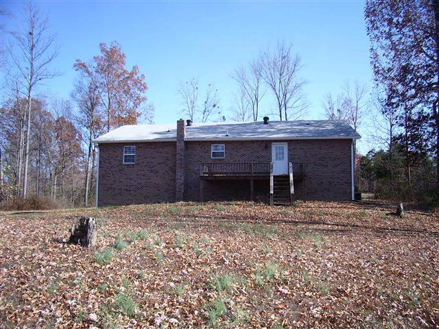 159 Hickory Road Big Rock, TN 37023 - Photo 3 of 20 Back view. Open sun deck. Open front & back lawn with the remainder of acreage being wooded.