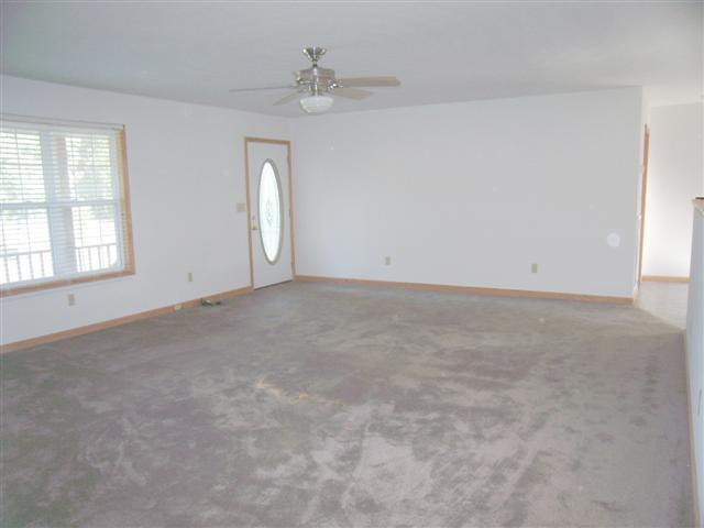 159 Hickory Road Big Rock, TN 37023 - Photo 9 of 20 Spacious rooms! Nice gathering room, carpet, ceiling fan, half wall divider to country kitchen.