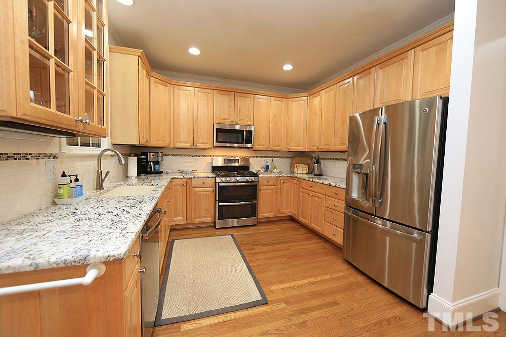 5208 Strathmore Drive Raleigh, NC 27613 - Photo 12 of 30 Hardwoods, Recessed Lighting, Pantry