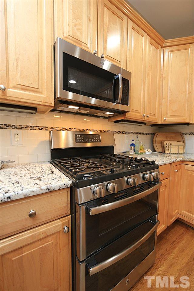 5208 Strathmore Drive Raleigh, NC 27613 - Photo 15 of 30 Enjoy the speed of cooking with gas & a micro-wave