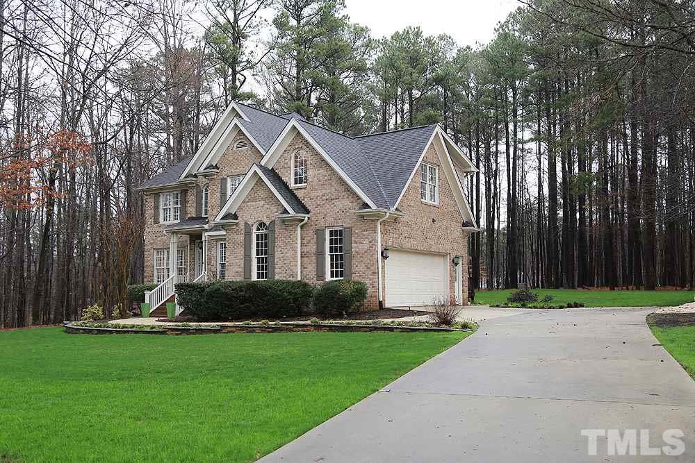 5208 Strathmore Drive Raleigh, NC 27613 - Photo 3 of 30 Well maintained yard, side entrance garage