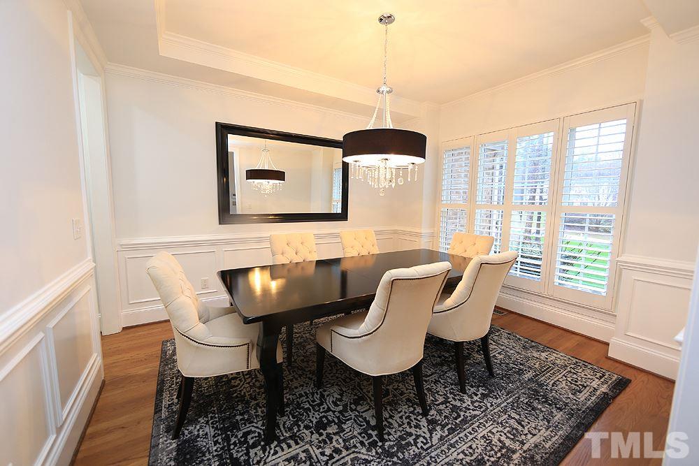 5208 Strathmore Drive Raleigh, NC 27613 - Photo 7 of 30 Hardwoods, Wainscoting, tTey ceiling, Shuitters