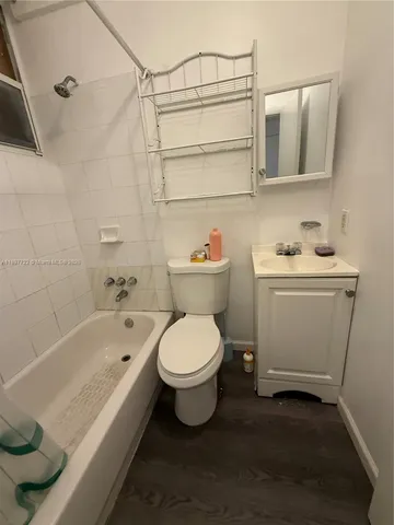 a bathroom with a sink toilet and bathtub
