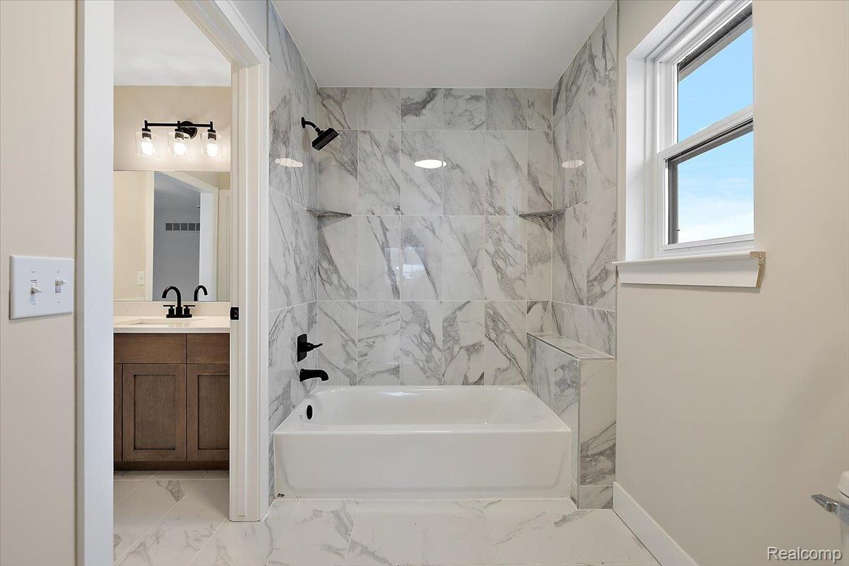 53650 Romeo Plank Road Macomb, MI 48042 - Photo 42 of 64 Full bathroom featuring vanity, shower / washtub combination