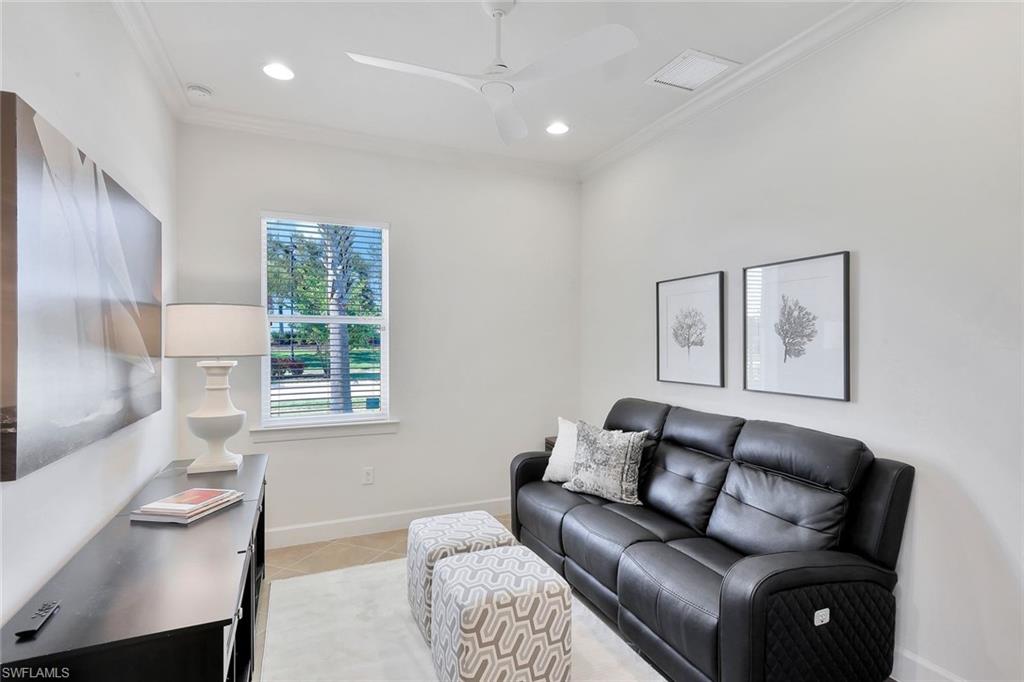 9058 Limestone Lane Naples, FL 34120 - Photo 13 of 48 a living room with furniture and a window