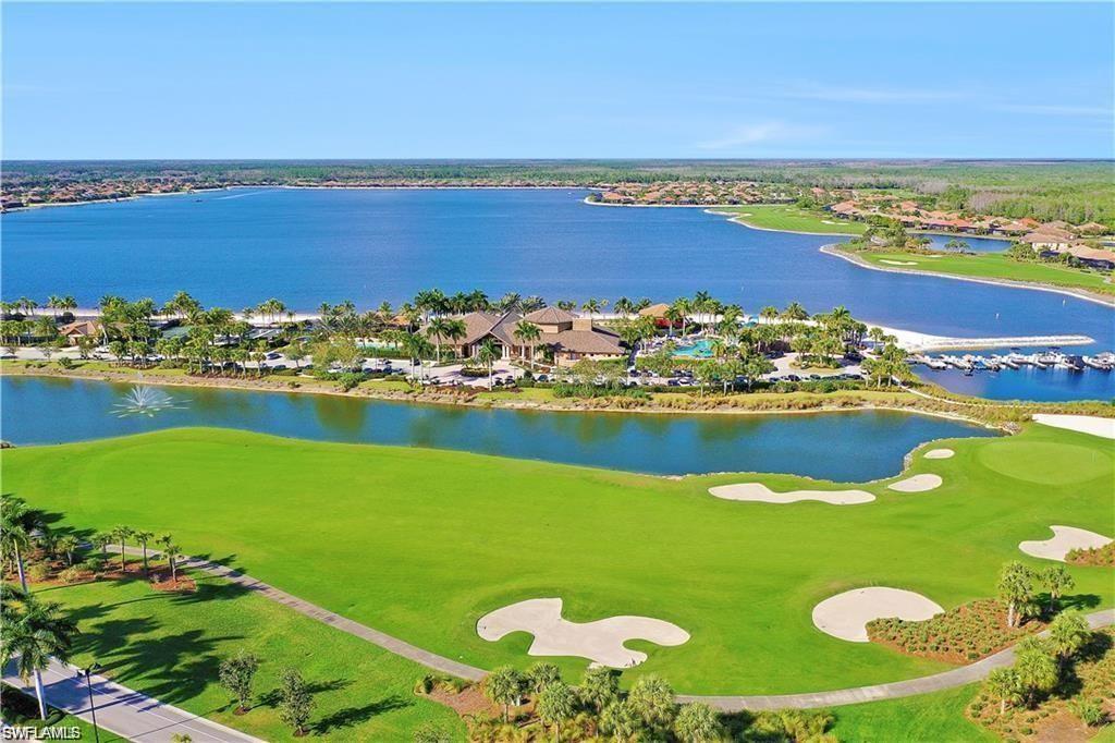 9058 Limestone Lane Naples, FL 34120 - Photo 30 of 48 a view of a lake with a city view