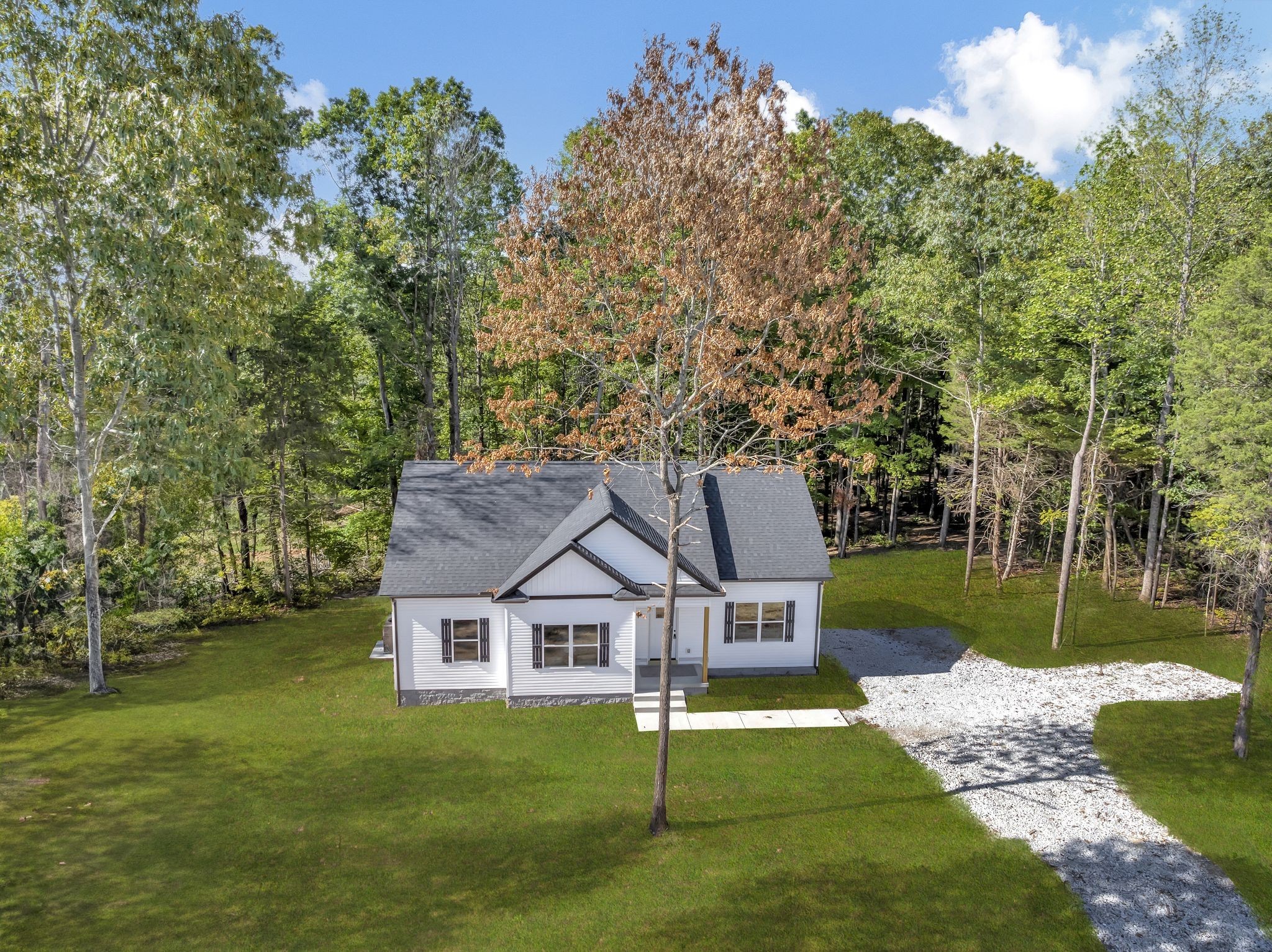 1514 East Piney Road Dickson, TN 37055 - Photo 1 of 29 a front view of a house with a yard