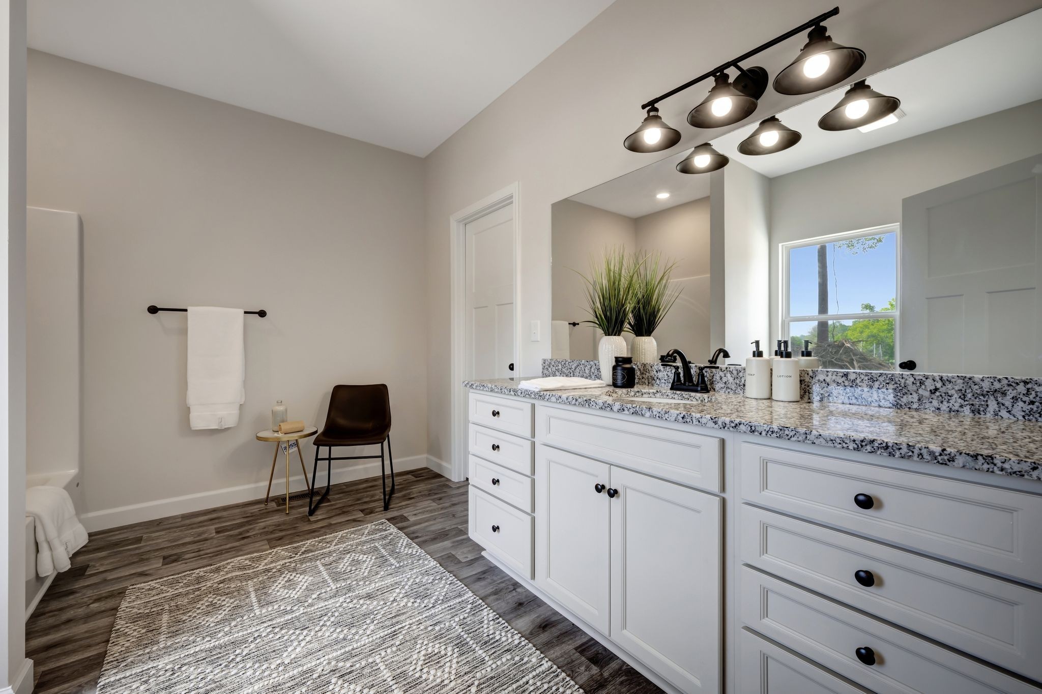 1514 East Piney Road Dickson, TN 37055 - Photo 12 of 29 a spacious bathroom with a granite countertop sink a toilet and a mirror