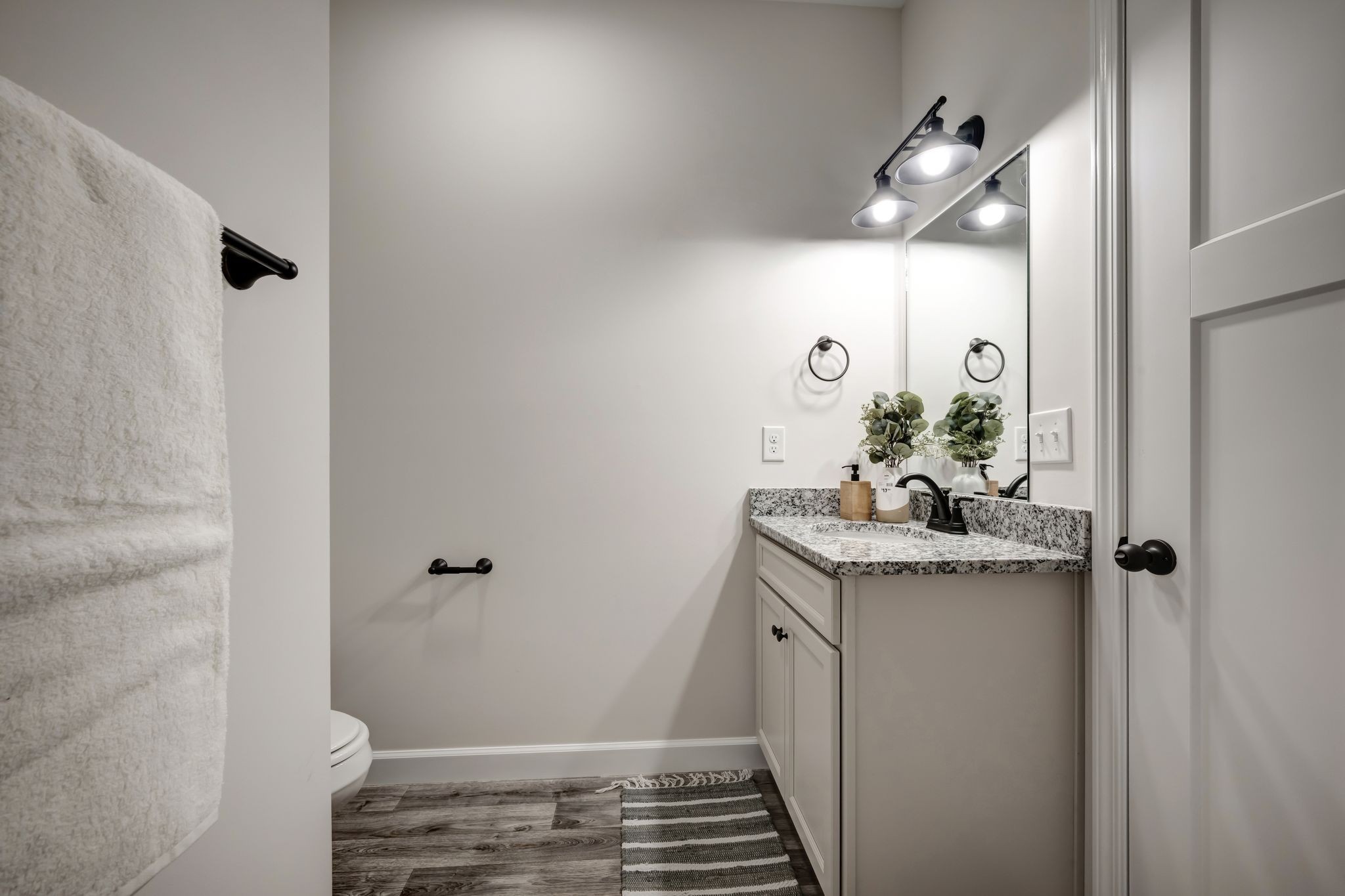 1514 East Piney Road Dickson, TN 37055 - Photo 21 of 29 a bathroom with a granite countertop sink and a mirror