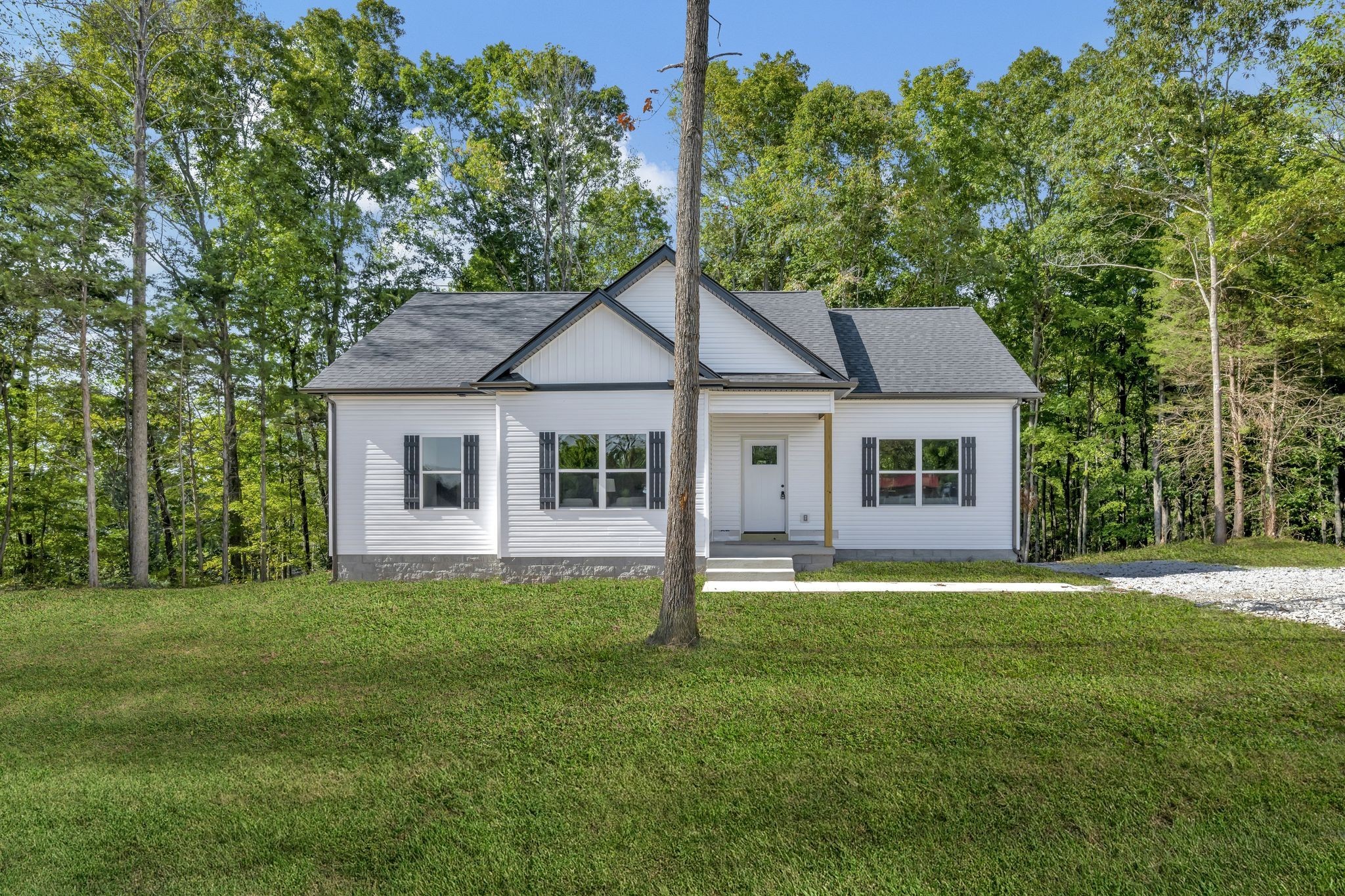 1514 East Piney Road Dickson, TN 37055 - Photo 24 of 29 a front view of a house with a yard