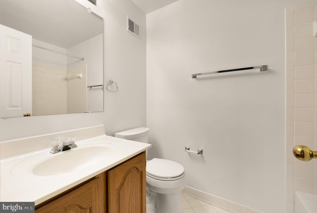 a bathroom with a sink toilet and vanity