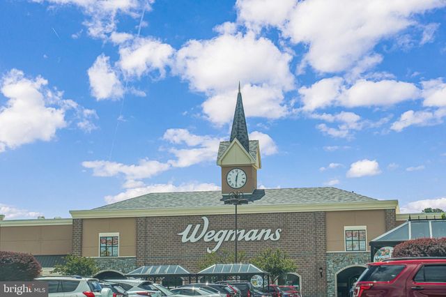 a view of a street with a building in the background