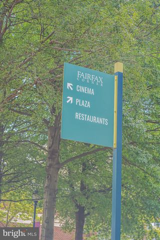 a sign that is sitting on a brick wall