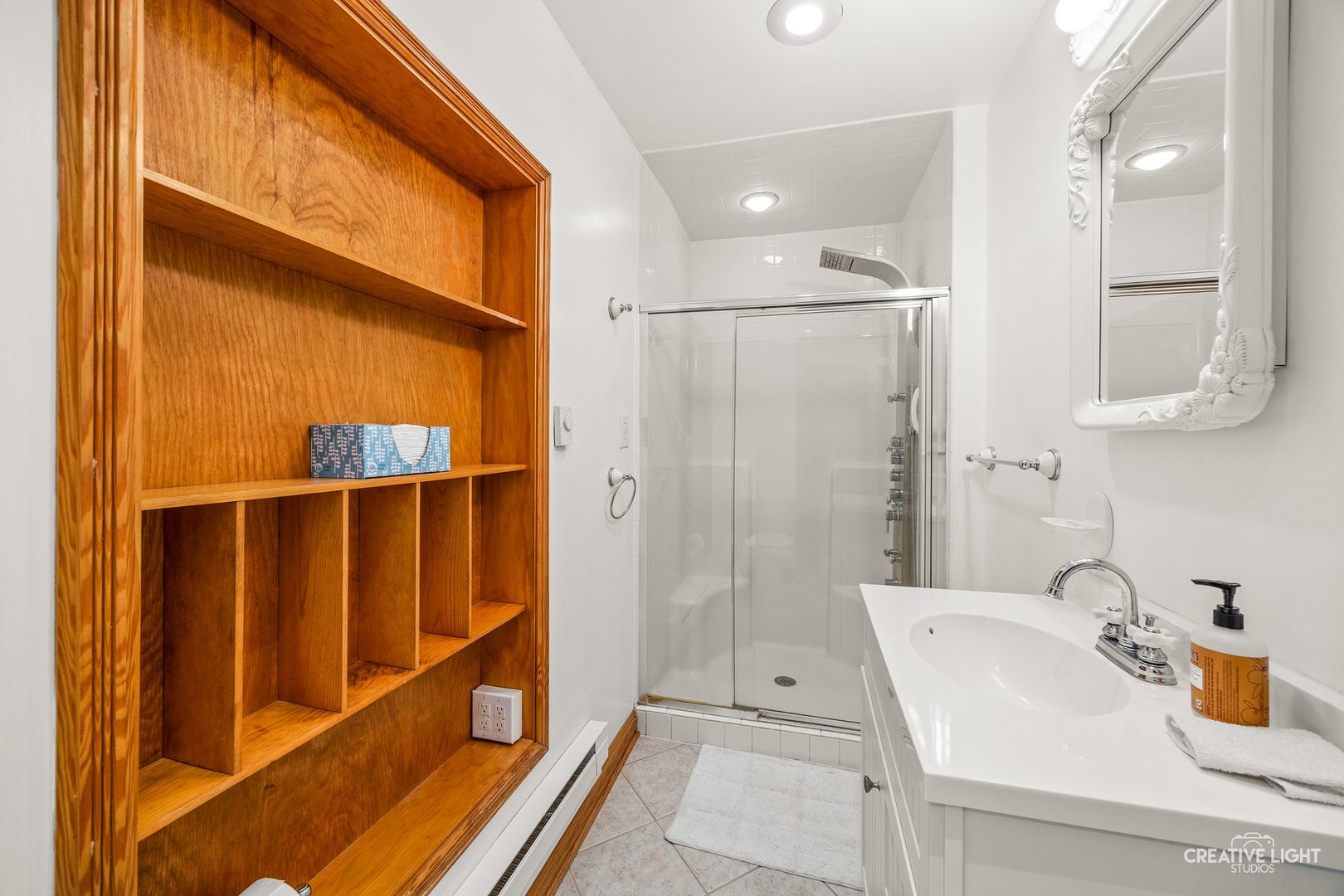 209 North Shabbona Road Shabbona, IL 60550 - Photo 13 of 25 a bathroom with a sink and a shower