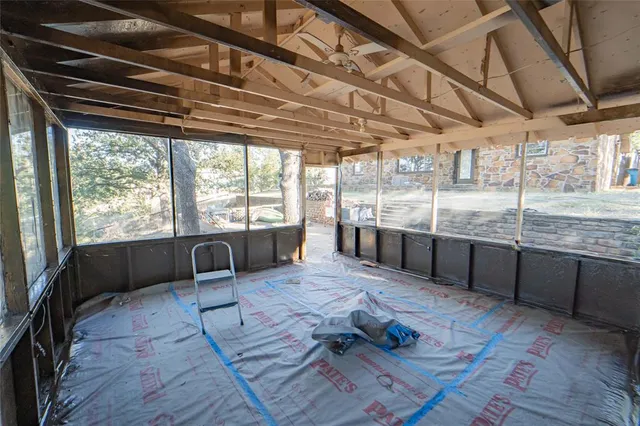 a living room with hard wood flooring and furniture