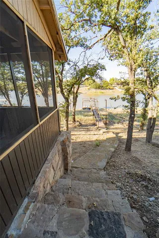 a view of road with large trees