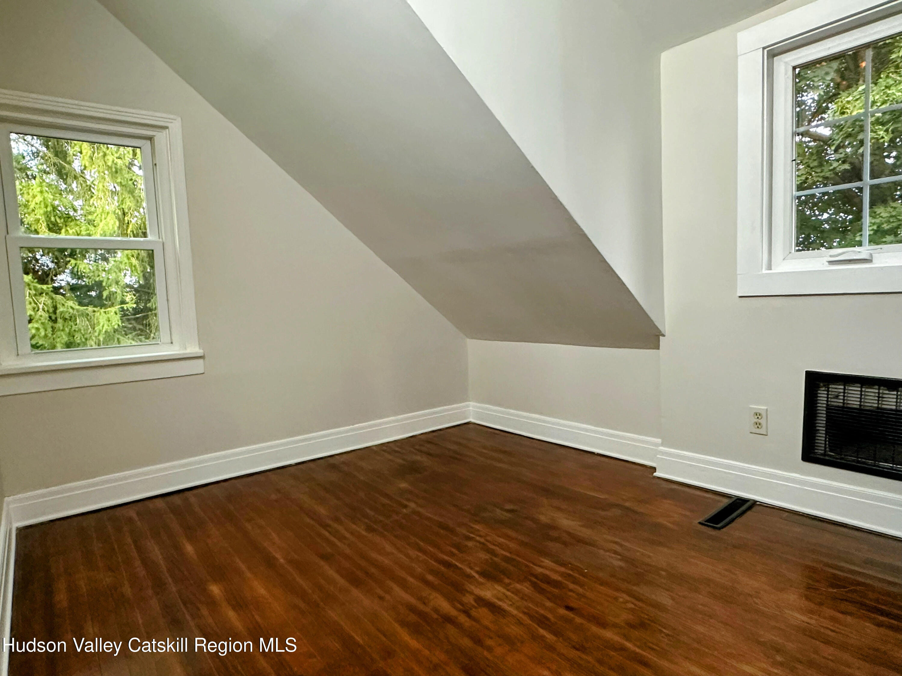 134 Lower Post Road Ghent, NY 12075 - Photo 11 of 19 a view of an empty room with wooden floor and a window