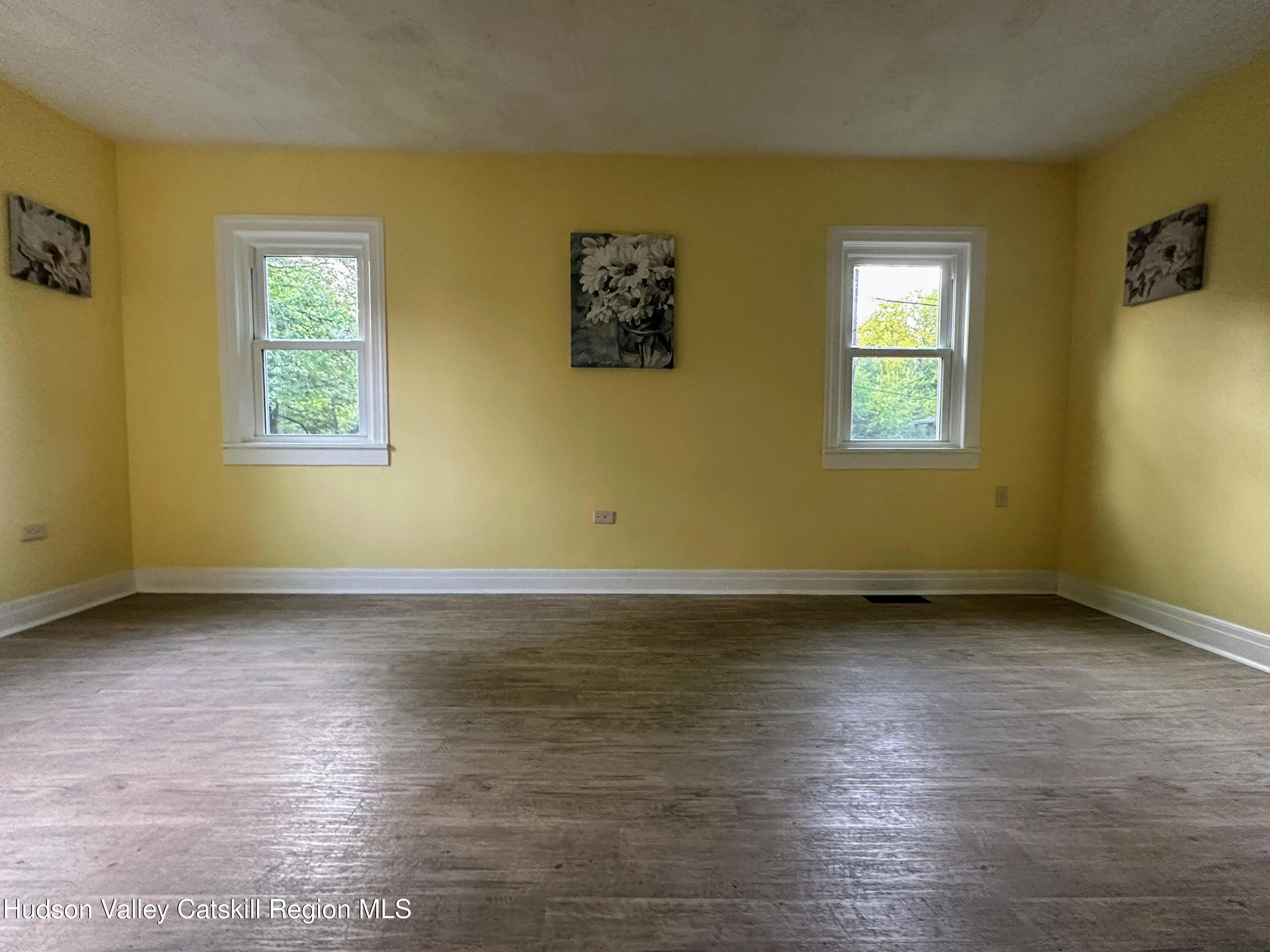 134 Lower Post Road Ghent, NY 12075 - Photo 4 of 19 a view of a room with wooden floor and window