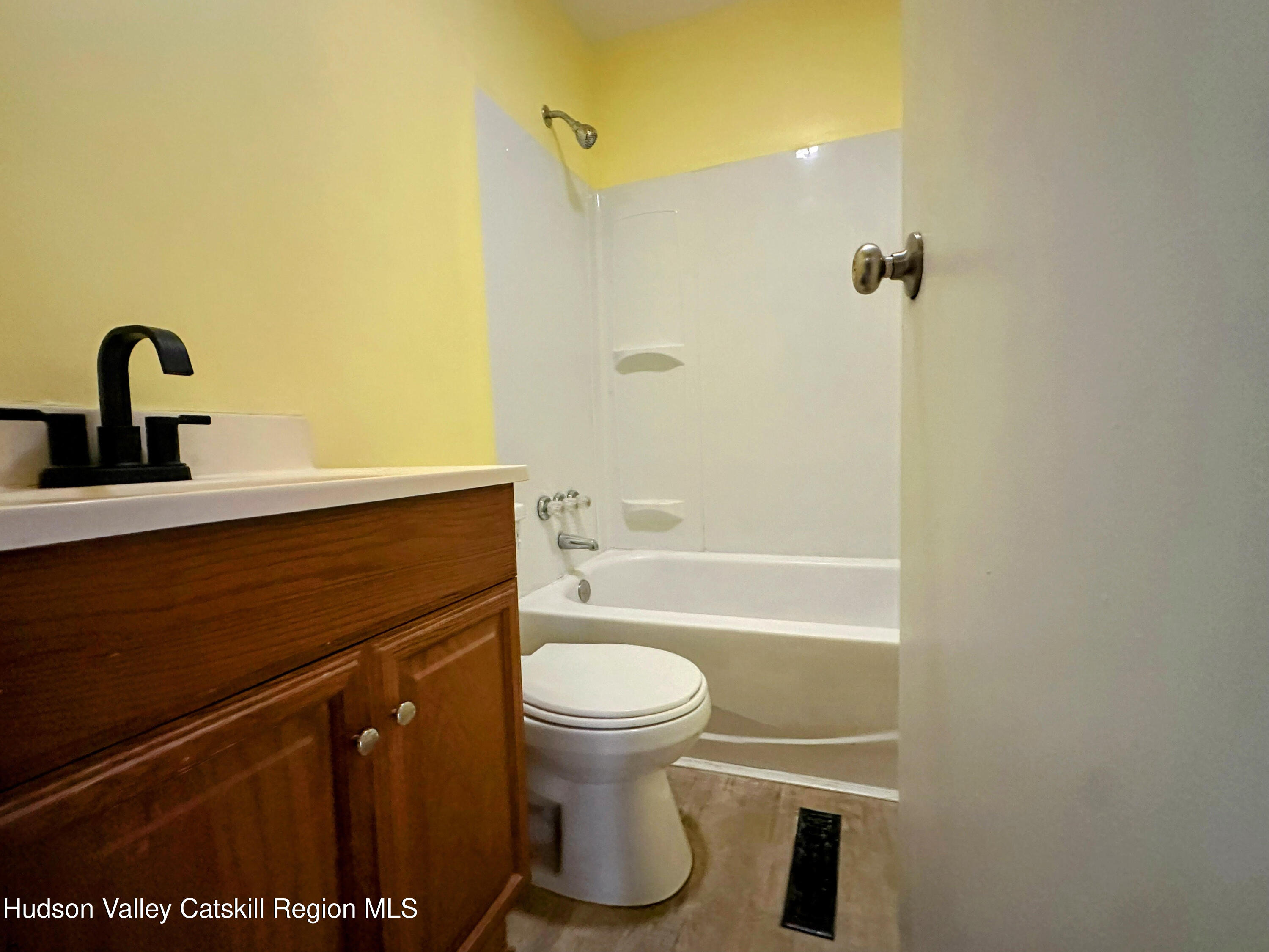 134 Lower Post Road Ghent, NY 12075 - Photo 7 of 19 a bathroom with a sink a toilet and a shower