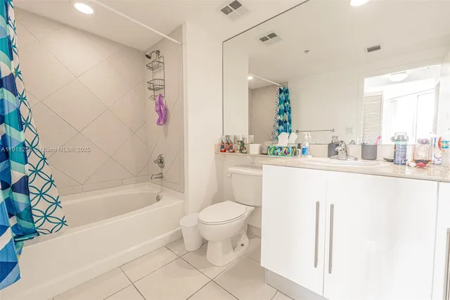 a bedroom with bed and window