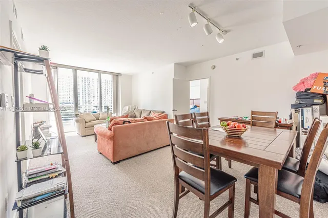 a kitchen with stainless steel appliances a refrigerator and a stove