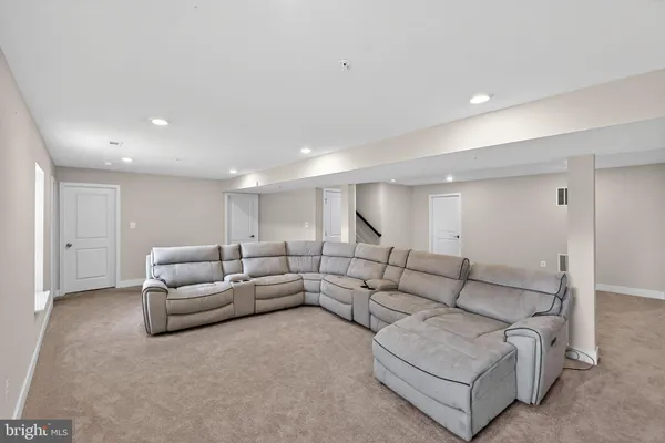 a living room with furniture and white walls