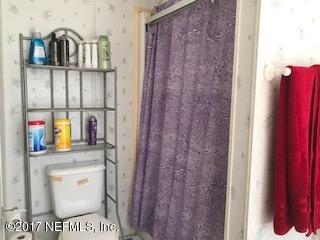 7268 Gas Line Road Keystone Heights, FL 32656 - Photo 11 of 12 a bathroom with a toilet and a sink