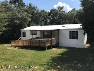 7268 Gas Line Road Keystone Heights, FL 32656 - Photo 2 of 12 a view of a house with a backyard