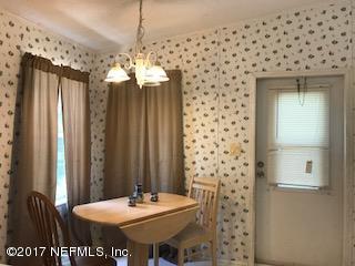 7268 Gas Line Road Keystone Heights, FL 32656 - Photo 7 of 12 a bathroom with a sink a mirror and a shower