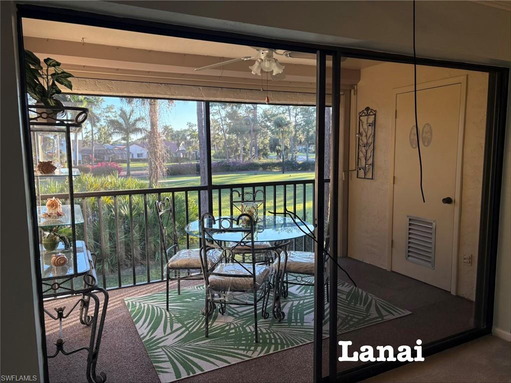 a view of a porch with furniture and outside view